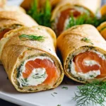 Pfannkuchen-Röllchen mit Frischkäse und Lachs First Image First Image