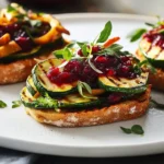 Schwedische Bruschetta mit gegrillter Zucchini und Cranberry-Sauce First Image First Image