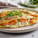 Gefüllte Kräuter-Omeletts mit Lachs und Hüttenkäse First Image First Image