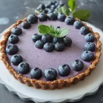 Vegane Tarte mit Nussboden und Heidelbeeren First Image First Image
