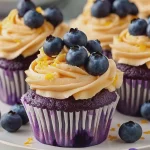 Blaubeer-Cupcakes mit Orangen-Frosting First Image First Image